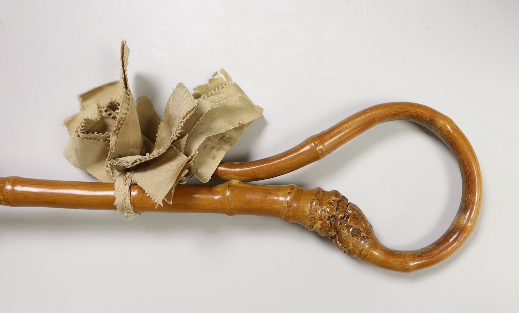 An embroidered parasol with bamboo handle. 88.5cm high